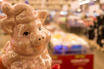 Obraz premium close up colorful porcelain pig on shop. The symbol of 2018 is a pig.