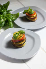 healthy vegetarian french ratatouille on white wooden background