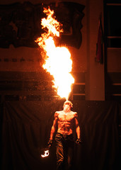 fire show, fire blowing performance, dancing with flame, male master fakir with fire works on street arts festival, fire breathing trick