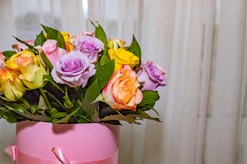 Colorful roses, beautiful flower bouquet.happy mother's day.Mix color roses in the box.pile of pink, yellow, orange, red, and white fresh roses isolated.round bouquet of multicolored roses