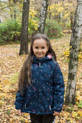 Autumn portrait of beautiful little girl 