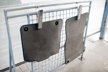 Car mats on a drying net at the car wash