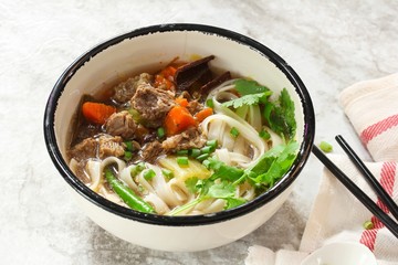 Pho Vietnamse Noodle Soup served in a bowl