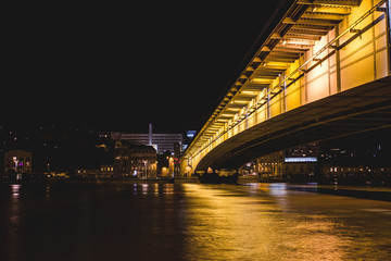 Fototapeta na wymiar Under bridge with light near river, Belgrade,Serbia