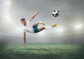 Fototapeta na wymiar Caucasian soccer Players in dynamic action with ball 