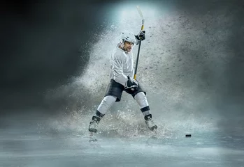 Fotobehang Caucasian ice hockey Players in dynamic action in a professional © Andrii IURLOV