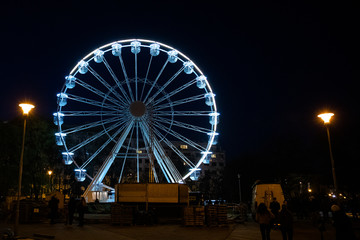 Biggest Ferris wheel in Brno, Czech Republic in Moravske square during set up for Christmas event captured at night time