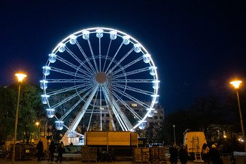 Biggest Ferris wheel in Brno, Czech Republic in Moravske square during set up for Christmas event captured at night time