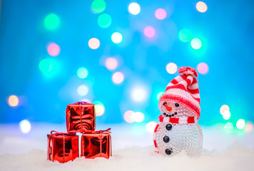 Christmas picture with a snowman and gifts