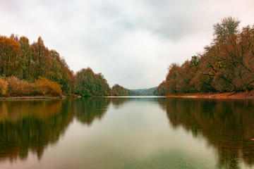 reflection of autumn forest in the river