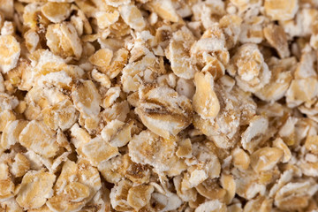 Rolled oats background. Organic oatmeal background texture