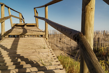 Naklejka premium bridge over sand at a beach