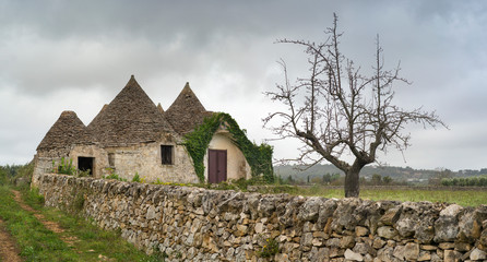 gray clouds above historical village in Puglia region in Italy