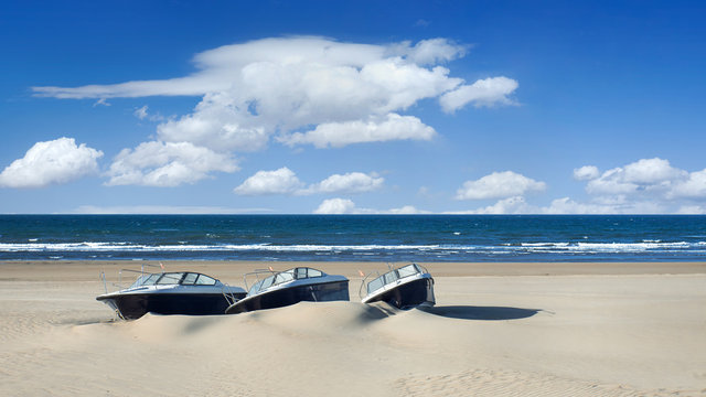 Speedboats parked on an abandoned tropical beach