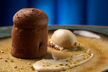 Chocolate Fondant cake and pistachio ice cream with English crea