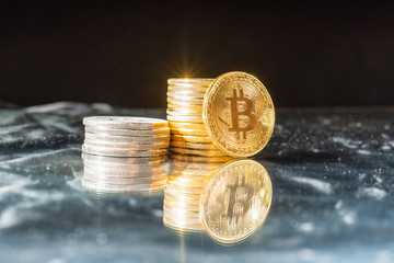Gold bitcoin on black background