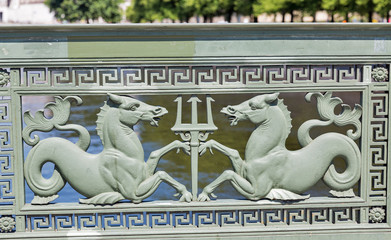 Latticework with mythical characters of Palace Bridge in Berlin, Germany.