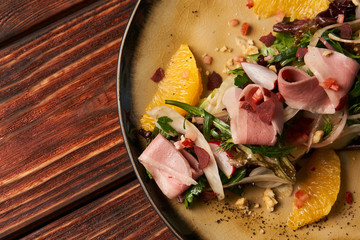 Exclusive vegetable salad with Smoked duck breast, close-up