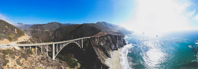 Aerial panoramic view of historic Bixby Creek Bridge along world famous Pacific Coast Highway 1 in...