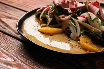 Spring vegetable salad with Smoked duck breast, close-up.