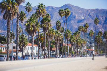 Beautiful view of Santa Barbara ocean front walk, with beach and marina, palms and mountains, Santa Ynez mountains and Pacific Ocean, Santa Barbara county, California, United States, summer sunny day