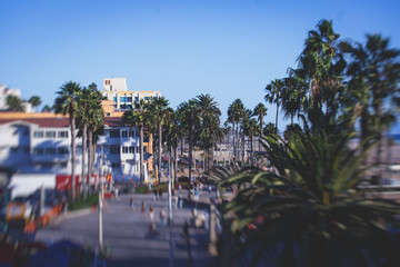 Fototapeta na wymiar View of historic Santa Monica pier, with beach, amusement park, shops and restaurants, Los-Angeles, California, United States of America