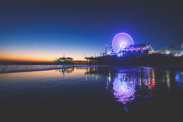View of historic Santa Monica pier, with beach, amusement park, shops and restaurants, Los-Angeles,...