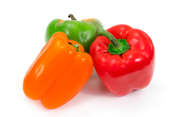 Paprika peppers with three sweet color green yellow and red on white background