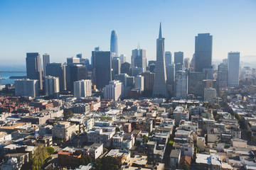 Beautiful super wide-angle aerial view of San Francisco, California, with Bay Bridge, Downtown, Ferry Market, and skyline scenery beyond the city, seen from the observation deck of Coit Tower