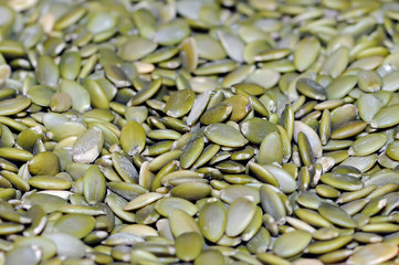 Macro background texture of green pumpkin seeds