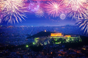 Fototapeten cityscape of Athens with illuminated Acropolis hill and Pathenon temple at night with fireworks, Greece © neirfy