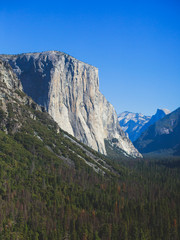 Beautiful summer view of Yosemite Valley , with El Capitan mountain, Half Dome mountain, Bridalveil waterfall, seen from Tunnel View vista point, Yosemite National Park, California, USA