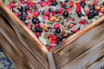 Dry fruit tea, blend with  leaves, berries in a wooden box