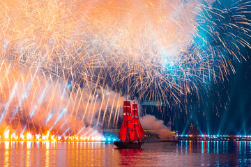 Swedish brig Tre Krunur on the annual celebration school graduates Scarlet Sails in St. Petersburg. Festive fireworks and light show over the Neva river.