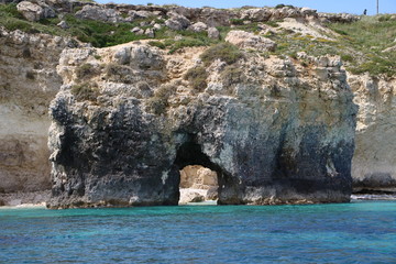 Arch at coast of Syracuse view from Mediterranean sea, Sicily Italy