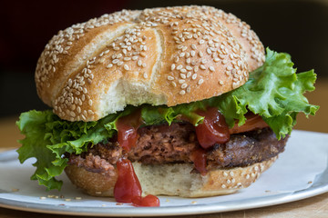 Veggie burger with lettuce and ketchup