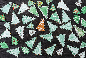 christmas tree cookies on a wooden background