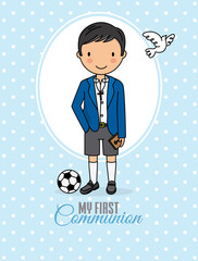 my first communion boy. Boy in communion costume and soccer ball