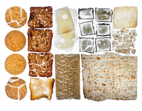 An assortment of cookies, bread and cheeses