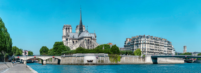 Pano of Notre-Dame de Paris (French for “Our Lady of Paris”), a medieval Catholic cathedral on the Cite Island in Paris, France - obrazy, fototapety, plakaty