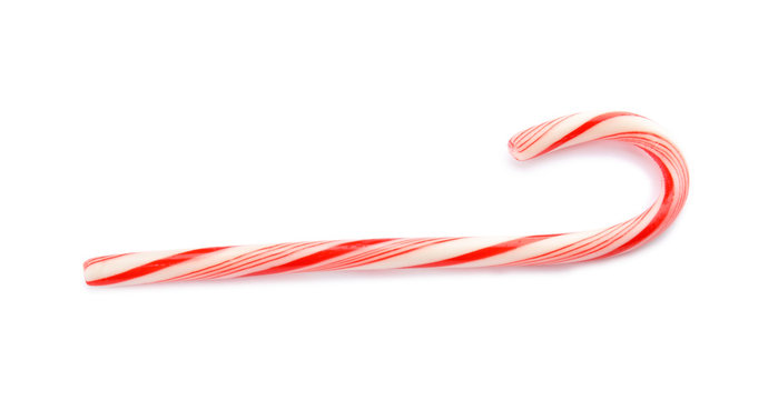 Tasty candy cane on white background. Festive treat