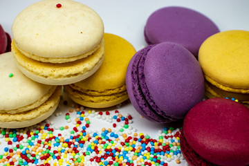 Fototapeta na wymiar Macaroons close - up with culinary decor isolated on a light background.