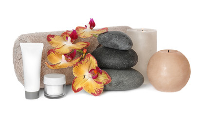 Composition with spa stones and candles on white background