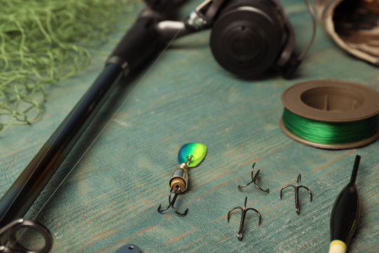 Fishing tackle on wooden table. Recreational activity