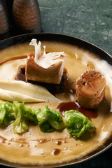 Chicken sausage meat with baked green cabbage, close-up