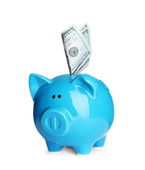 Piggy bank with money on white background