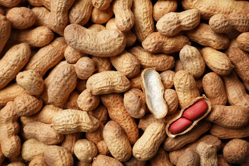 Dry peanuts in shell as background, top view. Healthy snack - obrazy, fototapety, plakaty