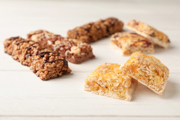 Tasty protein bars on white table. Healthy snack