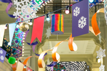 Fototapeta premium Сhristmas decorations: garland, serpentine, christmas toys, flags, snowflakes, lanterns