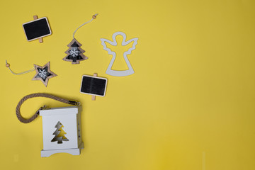 Star, Christmas tree, mini chalk board, wooden angel and candle box holder. Christmas decorations concept flat lay with copy space